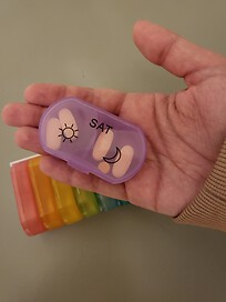 My daughter holding one of her anti seizure med pack dose for 1 day for