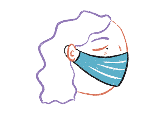 A woman wearing a medical face mask